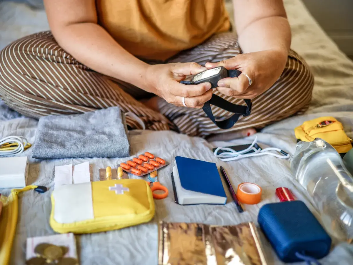 Person putting together emergency kit
