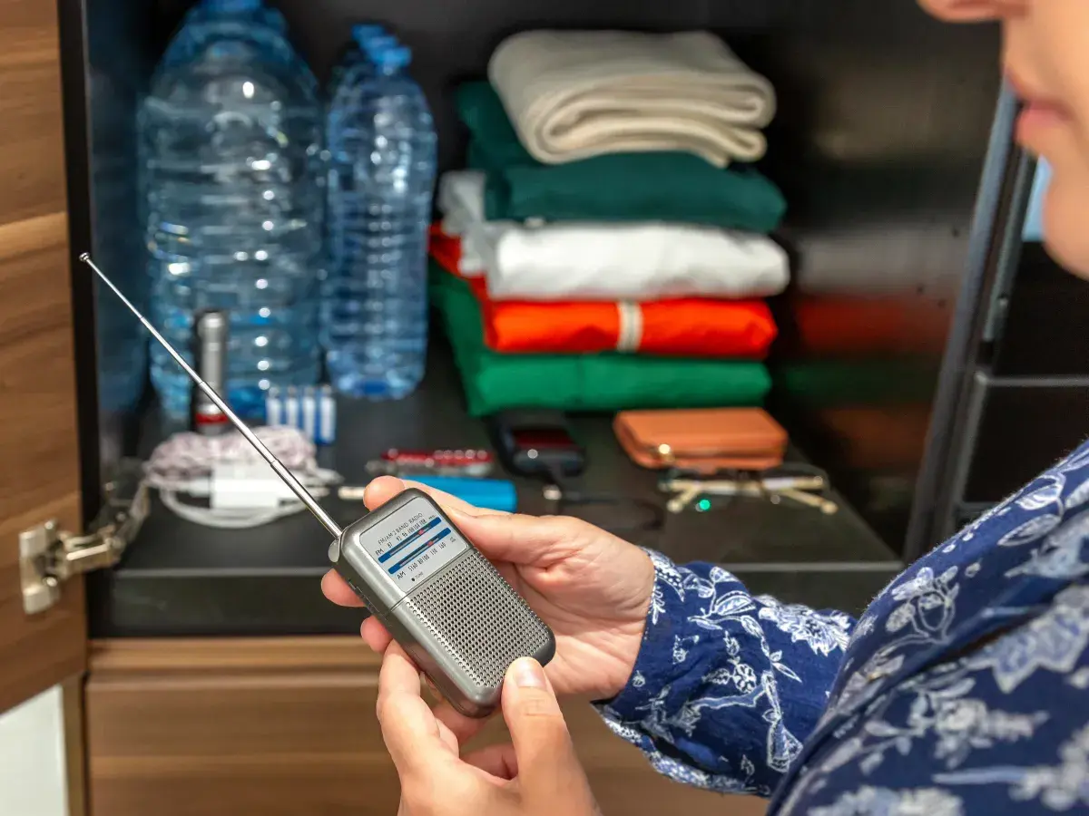 Person putting together emergency kit