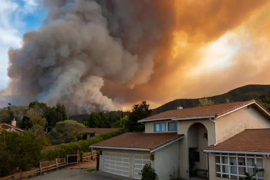 Wildfire approaching a home