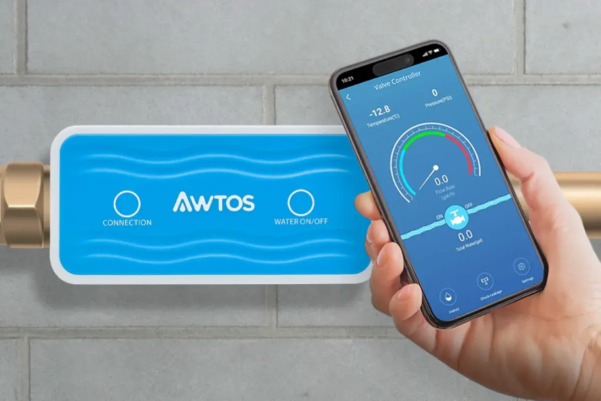 AWTOS App opened on phone in front of AWTOS Water Turn-Off Valve