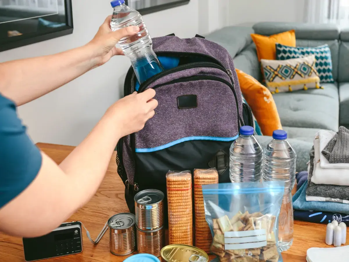 Person building an emergency kit