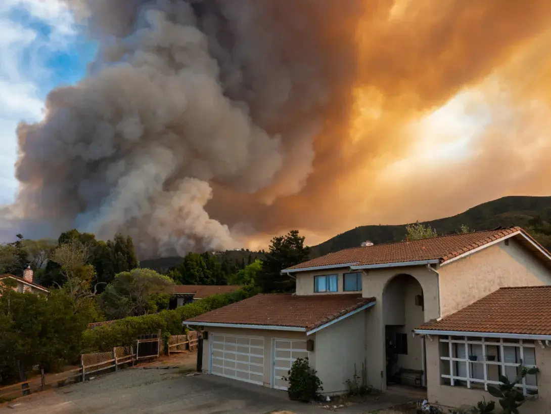 Wildfire approaching a home